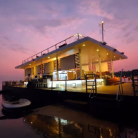 Luxury floating platform restaurant and lounge at sunset by eDrive Water Sports Dubai