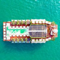 Aerial view of luxury floating platform with pool on the sea by eDrive Water Sports Dubai