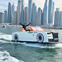 Man enjoying jet car ride with Dubai Marina skyline in background